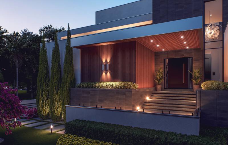 Crescendo entry with wood cladding